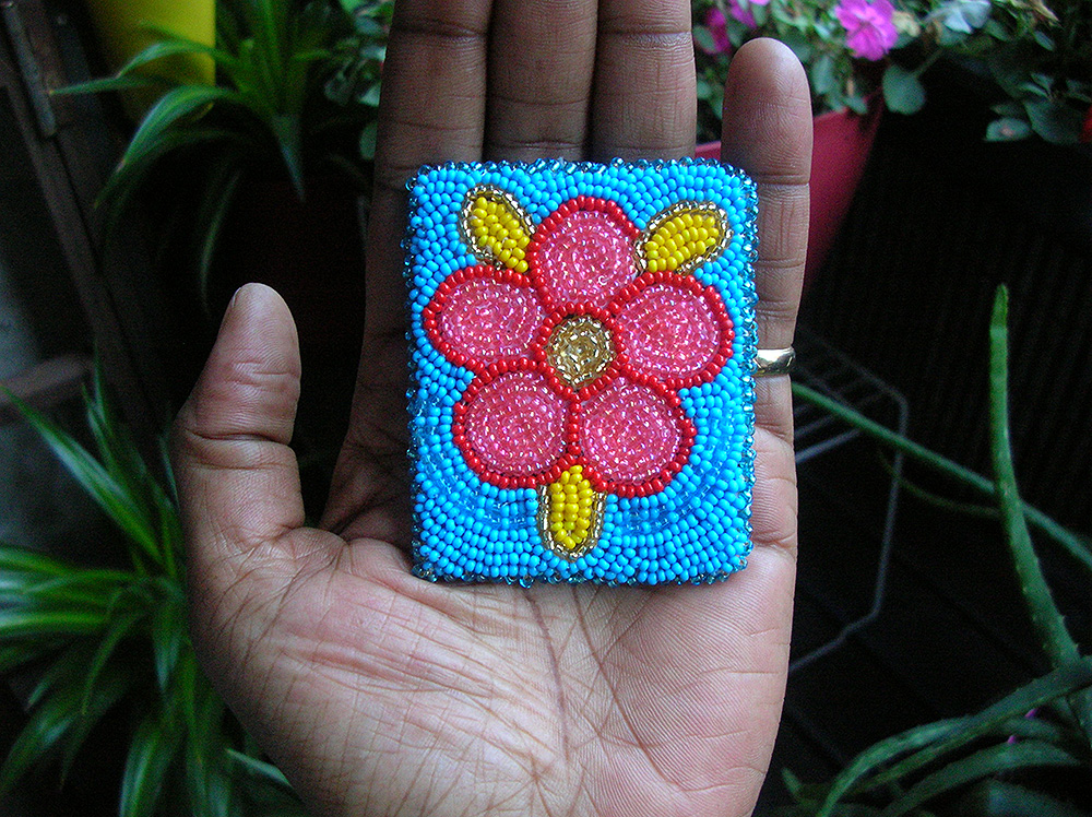 Completed beadwork of five-petal Métis rose